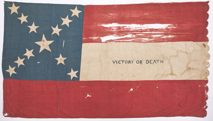 CSA First National Flag Rare hand-sewn cotton presentation war-date First National Flag, 40.75 x 71.5, created ca. November 1861. Blue canton with 12 white stars, eleven 4.25
arranged in three groups of three and one of two, and a centr